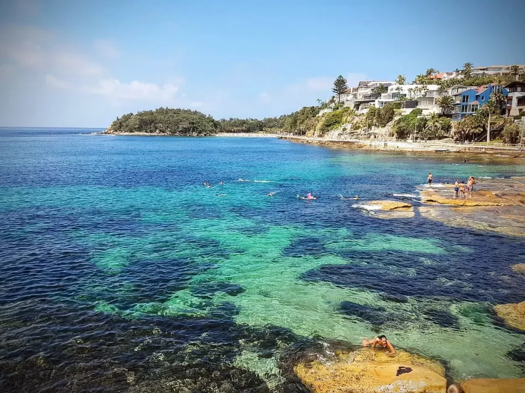 Visitors snorkeling at Manly Beach